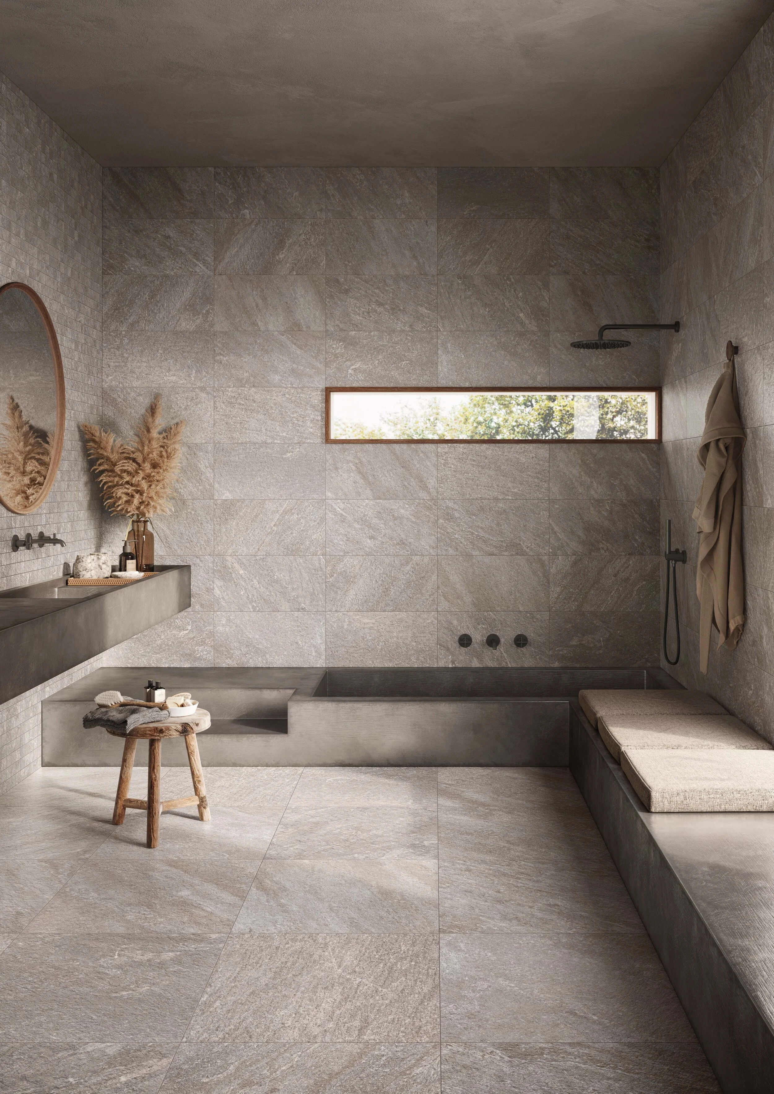Choose coloured glass and wooden accessories over plastic in the bathroom. Walls and floor: Petra Antracite.