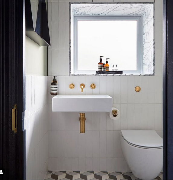 White, upstanding tiles provide a great base for the marbled window sill and geometric floor tiles. Image: Born &amp; Bred Studio. Photographer: @annastathakiphoto
