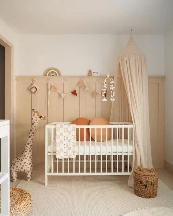 This bespoke panelling was a DIY project by Luke Arthur Wells. He added in peg hooks so that decorative bunting could be displayed over the cot.