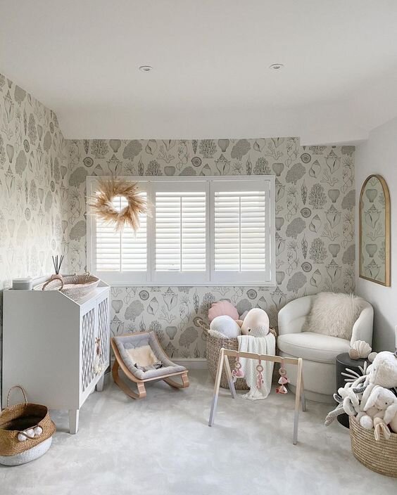 This is a beautiful gender-neutral nursery from Lust Living. The shell wallpaper is by Ferm Living which you can buy via Dot Maison.