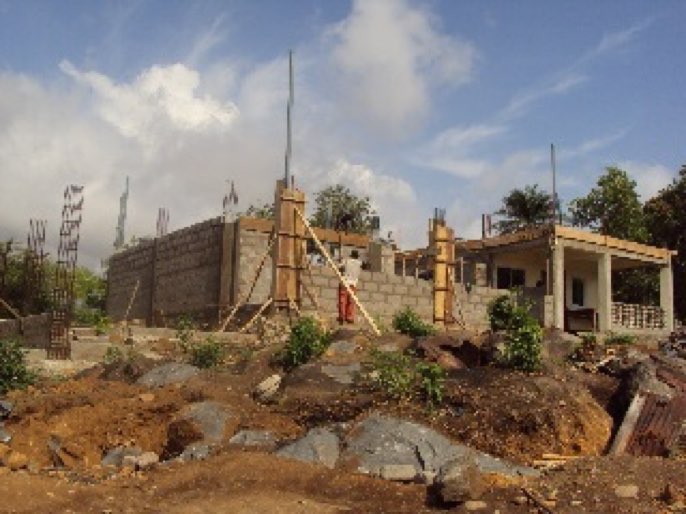 May 2014 - Building the walls of the first classroom.