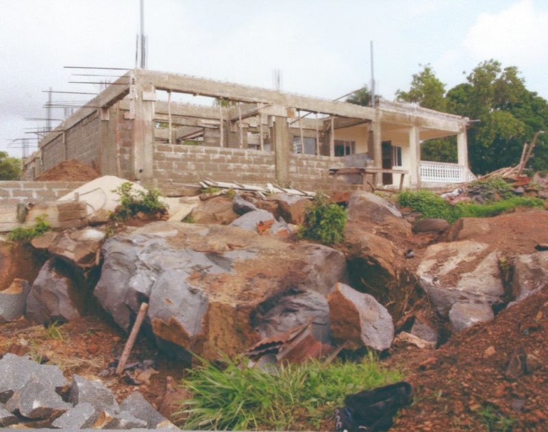 Aug 2014 - Breaking huge boulders to level school site.