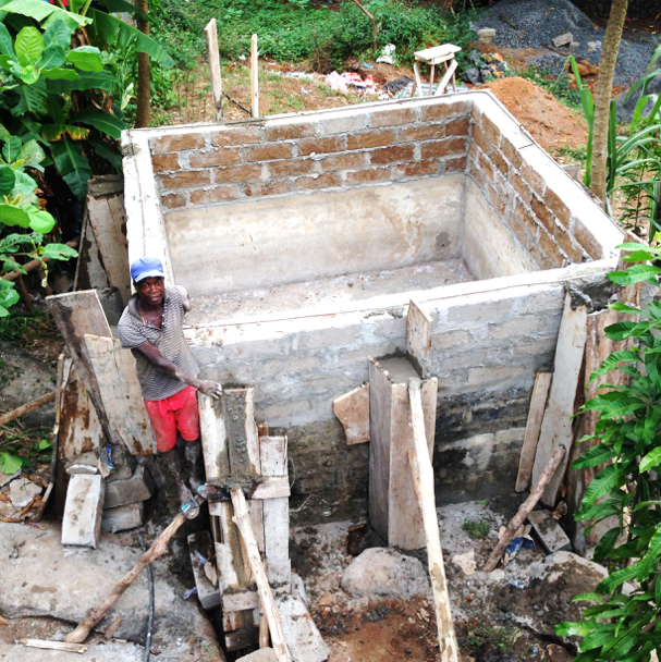 Mohamed. our caretaker enlarging the water tank