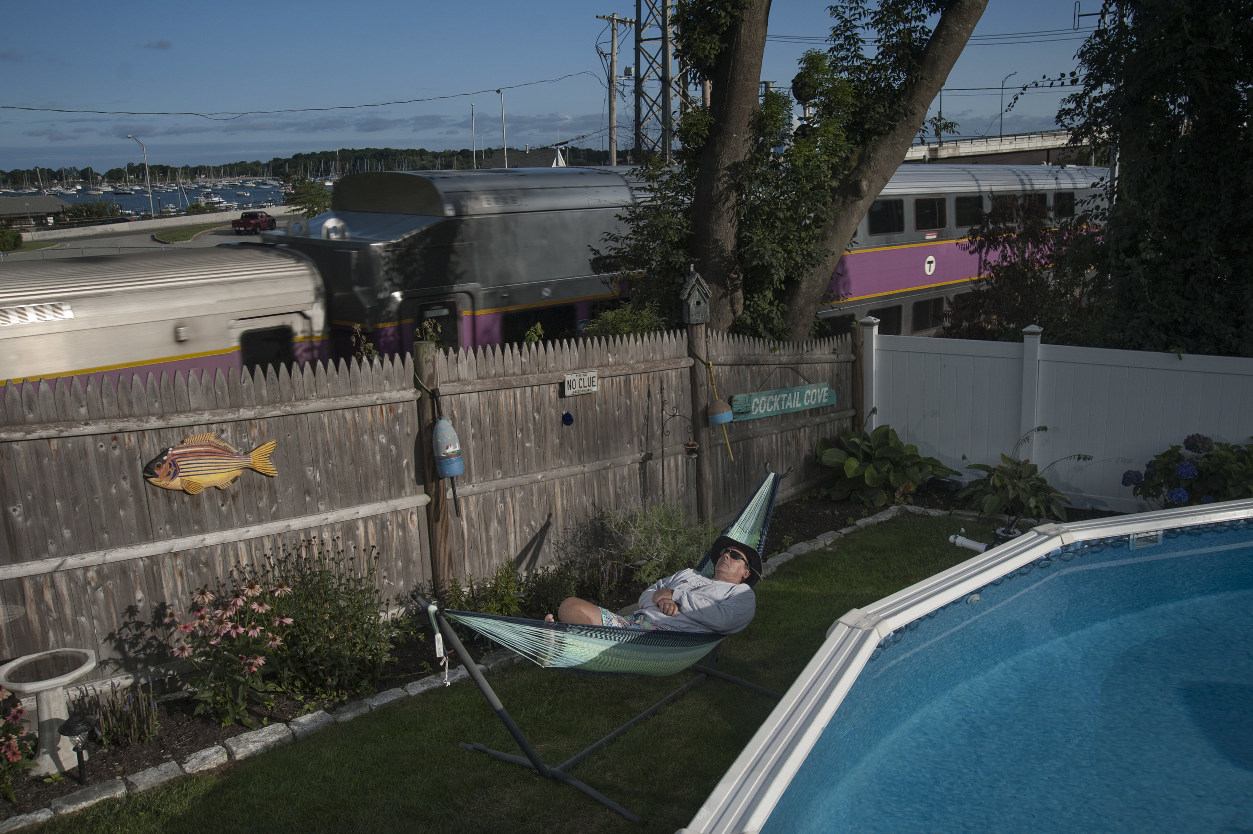 Kevin in hammok in Bev backyard3.jpg