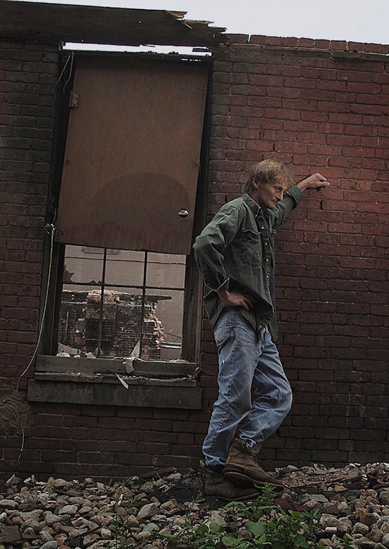 Man against wall in Amesbury.jpg