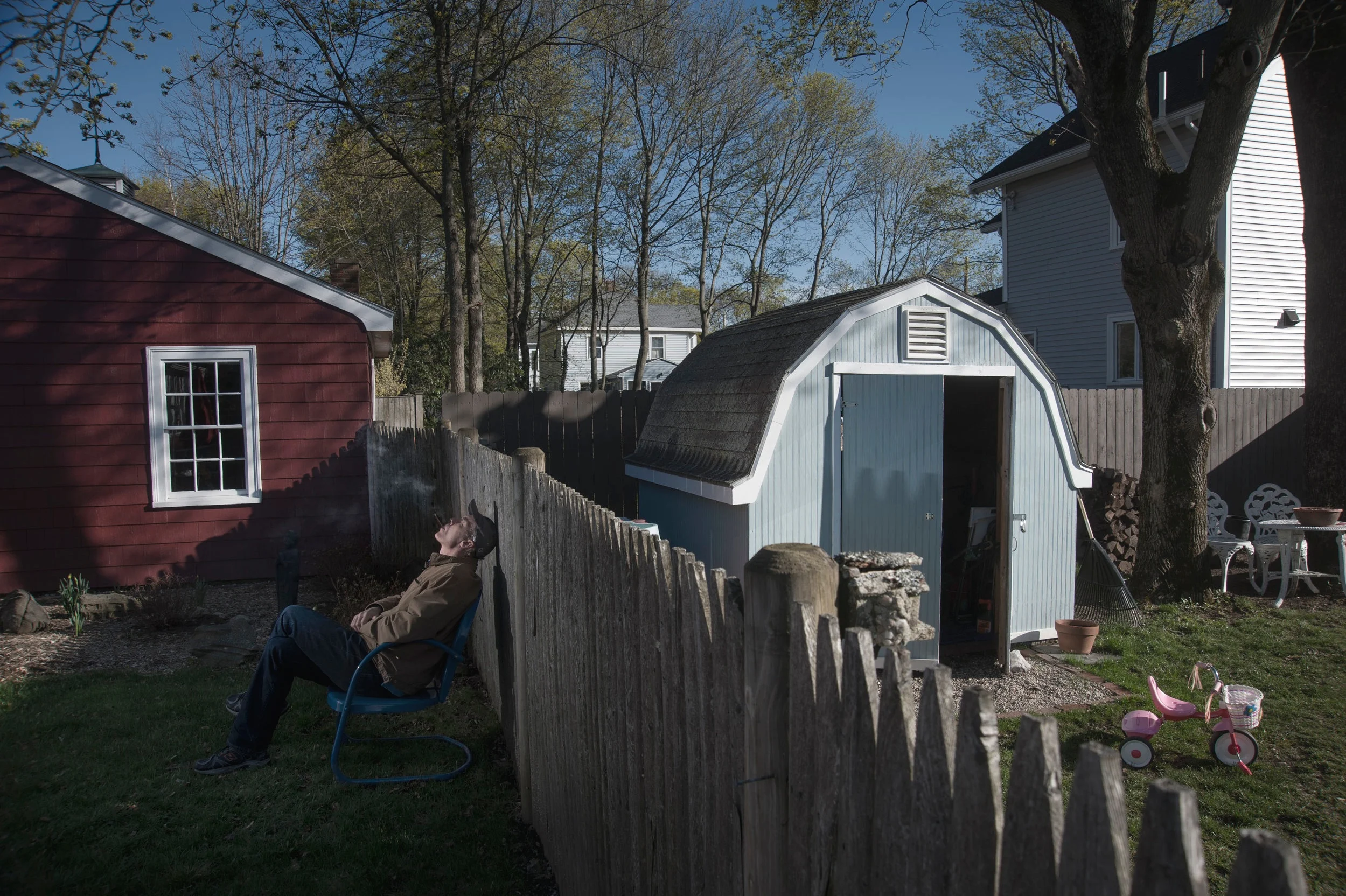 Self in Backyard w cigar fence.jpg