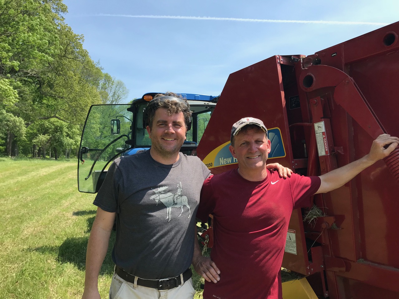 Andy Stevenson and Bob Robichaud tag teamed to get the hay cut and baled on a hot summer day.