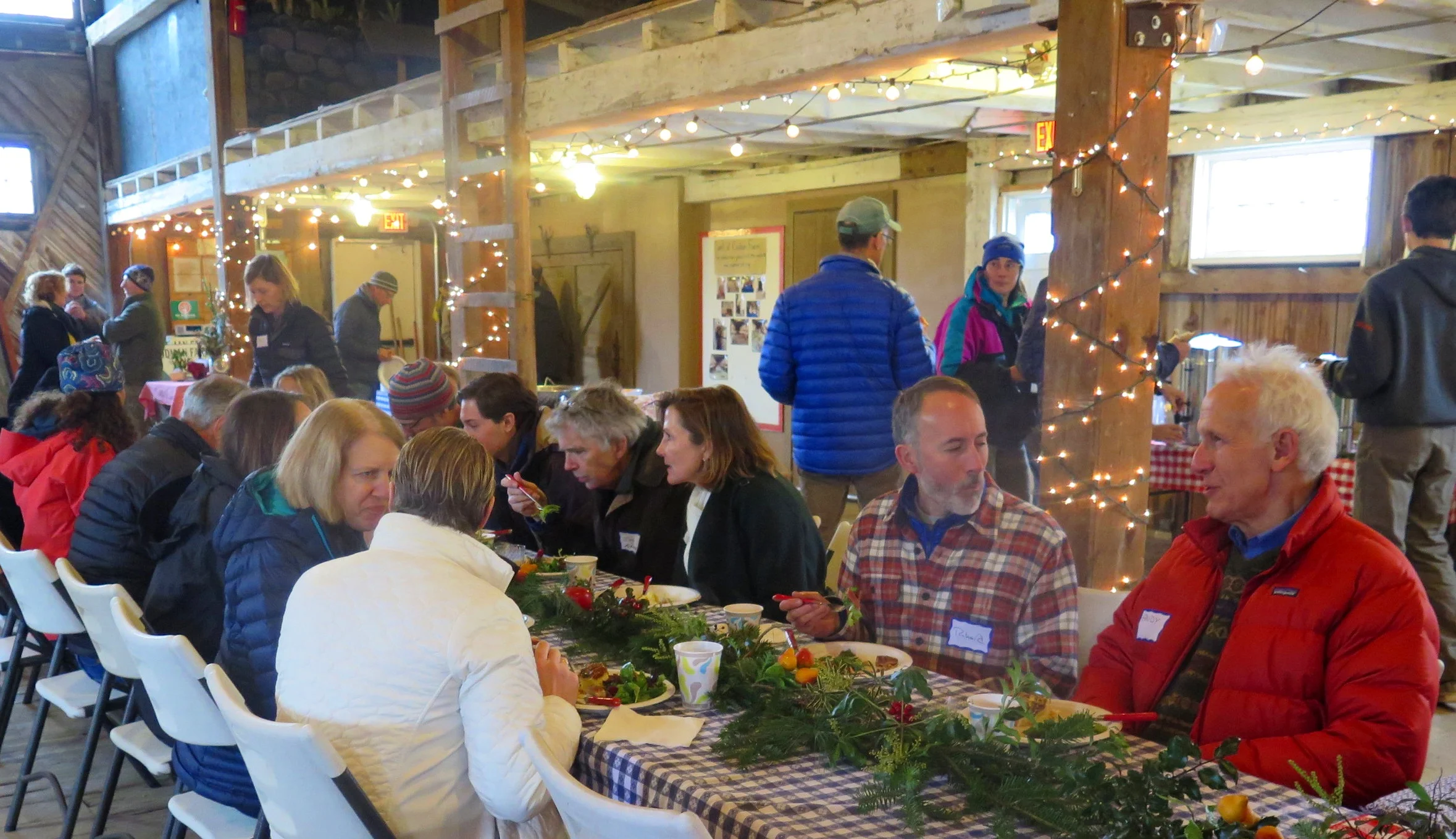 Volunteers enjoying brunch and conversation, featuring all things Codman.