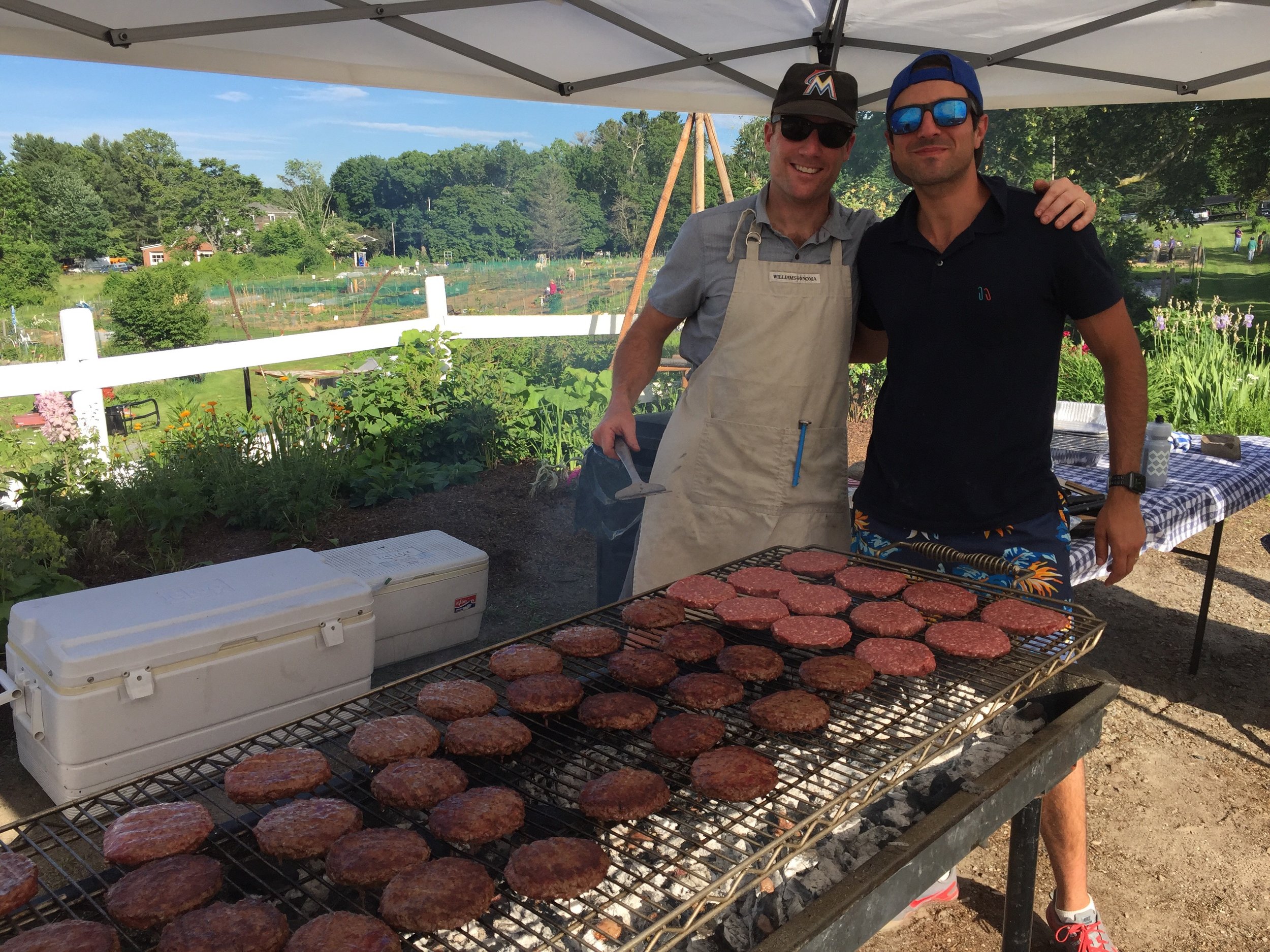 John and Jon, board members during the week, grill masters on the weekend!