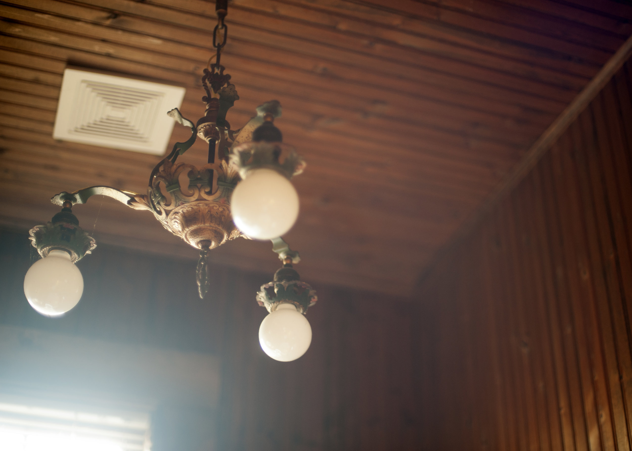 This chandelier is one of the many remnants of the building's heritage. Image credit: Emily Bartos