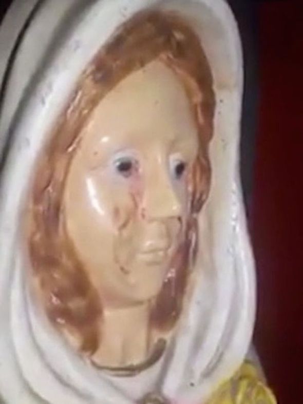 A still image of the statue with its 'bloody' tears.
