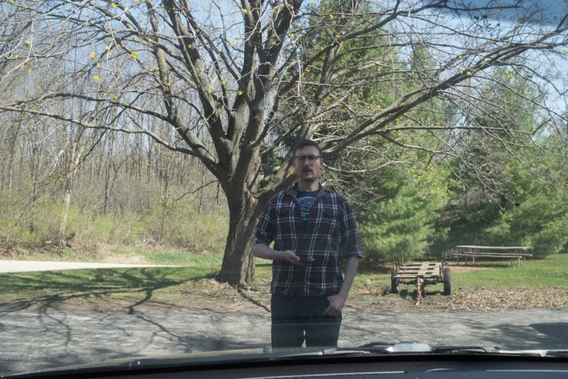 Taken from inside the van, this image shows investigator Tobias Wayland standing in the approximate location the witness said he saw the creature.