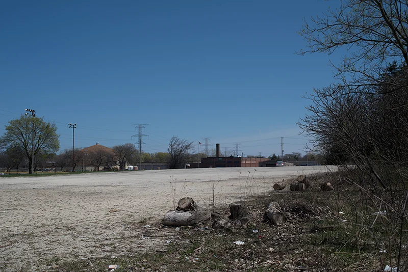 View across the parking lot of the street and developed area to the east.