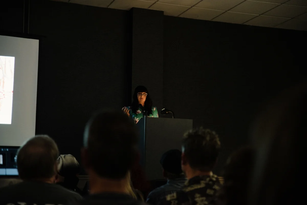 Sarah Chavez talking about the ritual connection between food, death, and the afterlife in human culture during her presentation Feeding the Dead - Food in Death Rituals, Ancestor Worship, and Festivals.