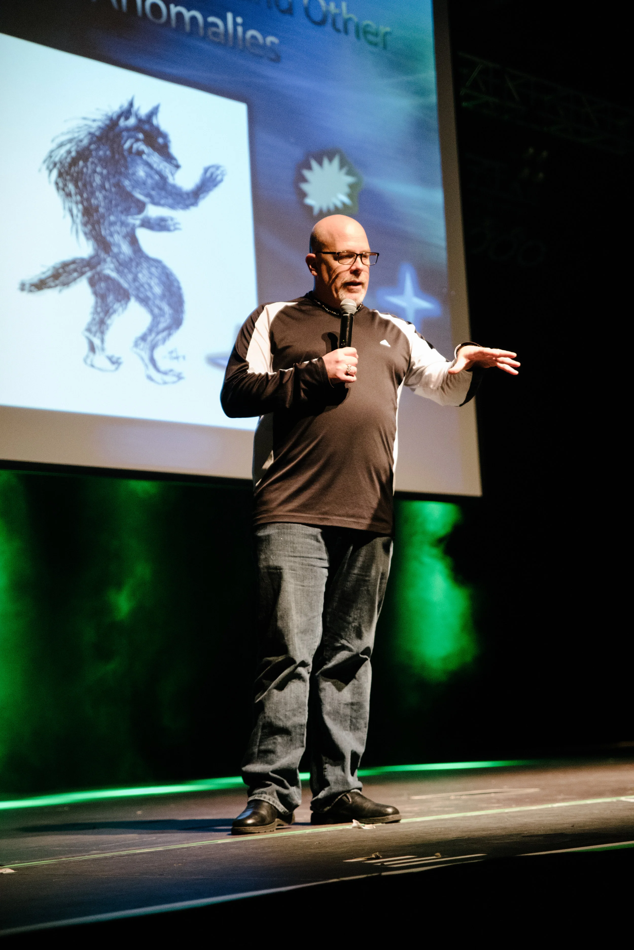 Darkness Dave introducing guest speaker Linda Godfrey.