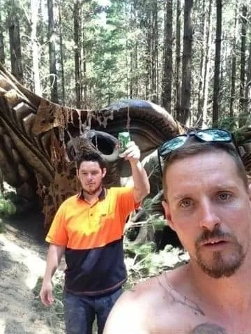 This image attached to case #99500 shows two men taking a selfie in front of the ‘UFO.’ (MUFON)