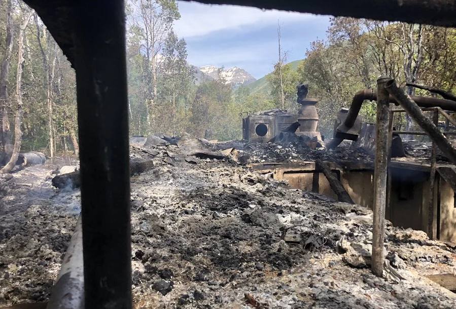 Smoking ruins of “The South Fork Haunted House”. (Spencer Cannon / Twitter)