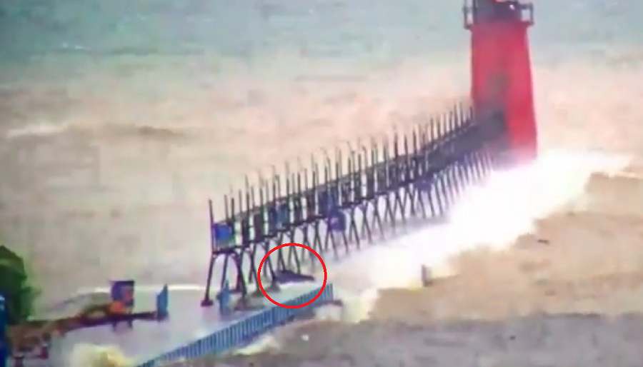 Tim Wenzel posted a video clip taken from a live webcam that appears to show a serpentine object bandied about by Lake Michigan’s choppy waters. (Tim Wenzel / WWMT)