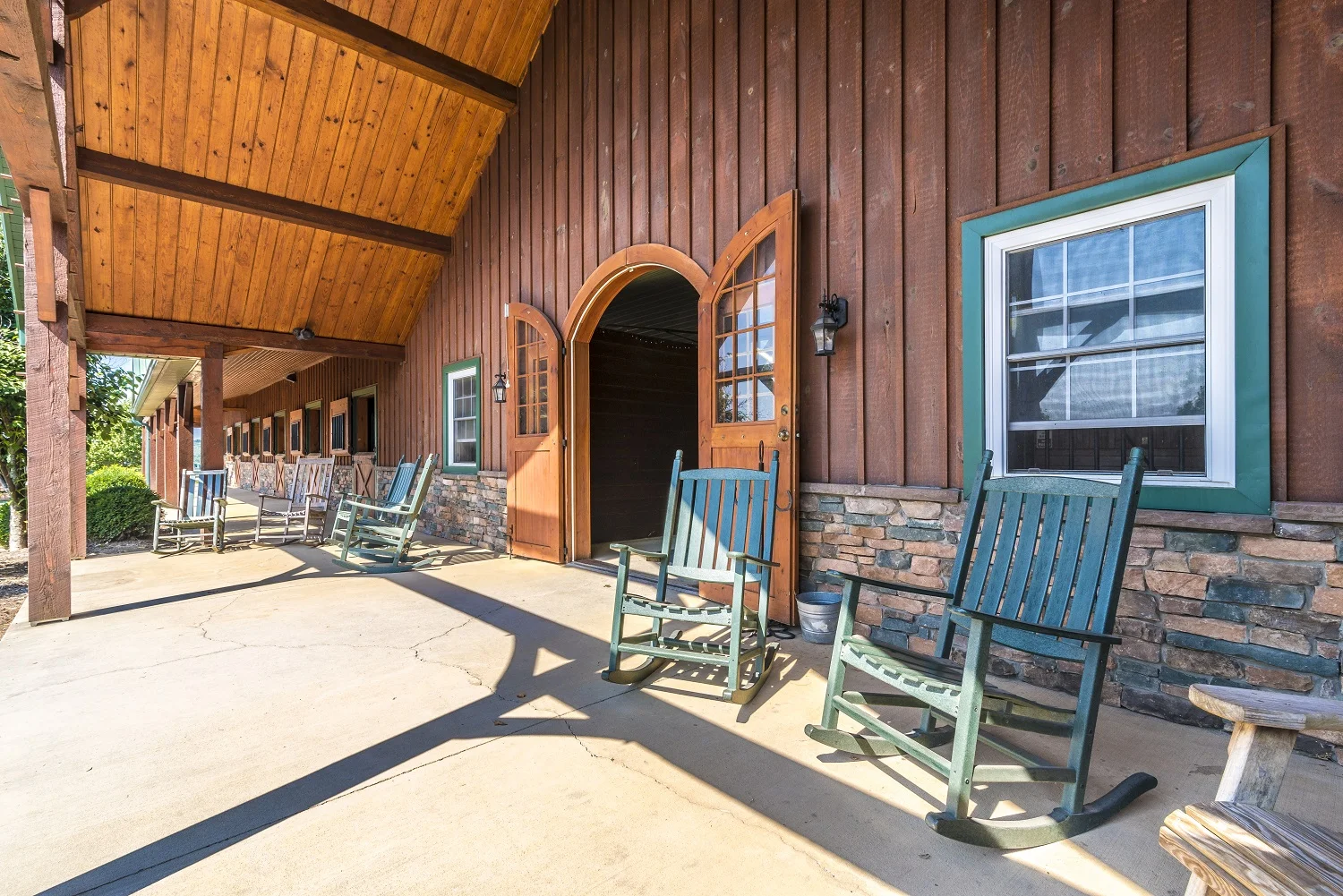 After spending time with your horse, Relax in the rocking chairs on our front porch overlooking the rolling hills of Maryland