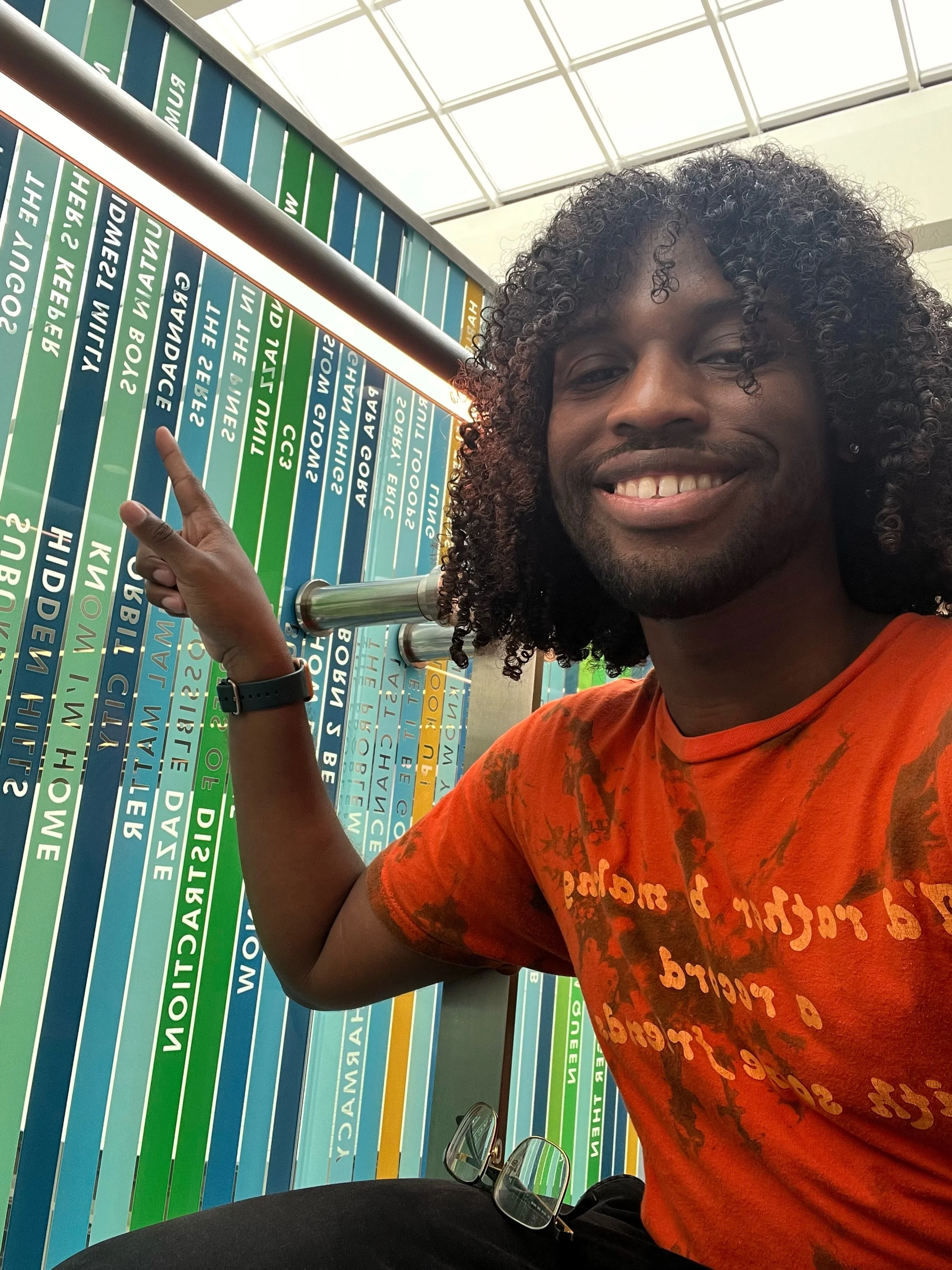 grandace in front of social stairs at the library