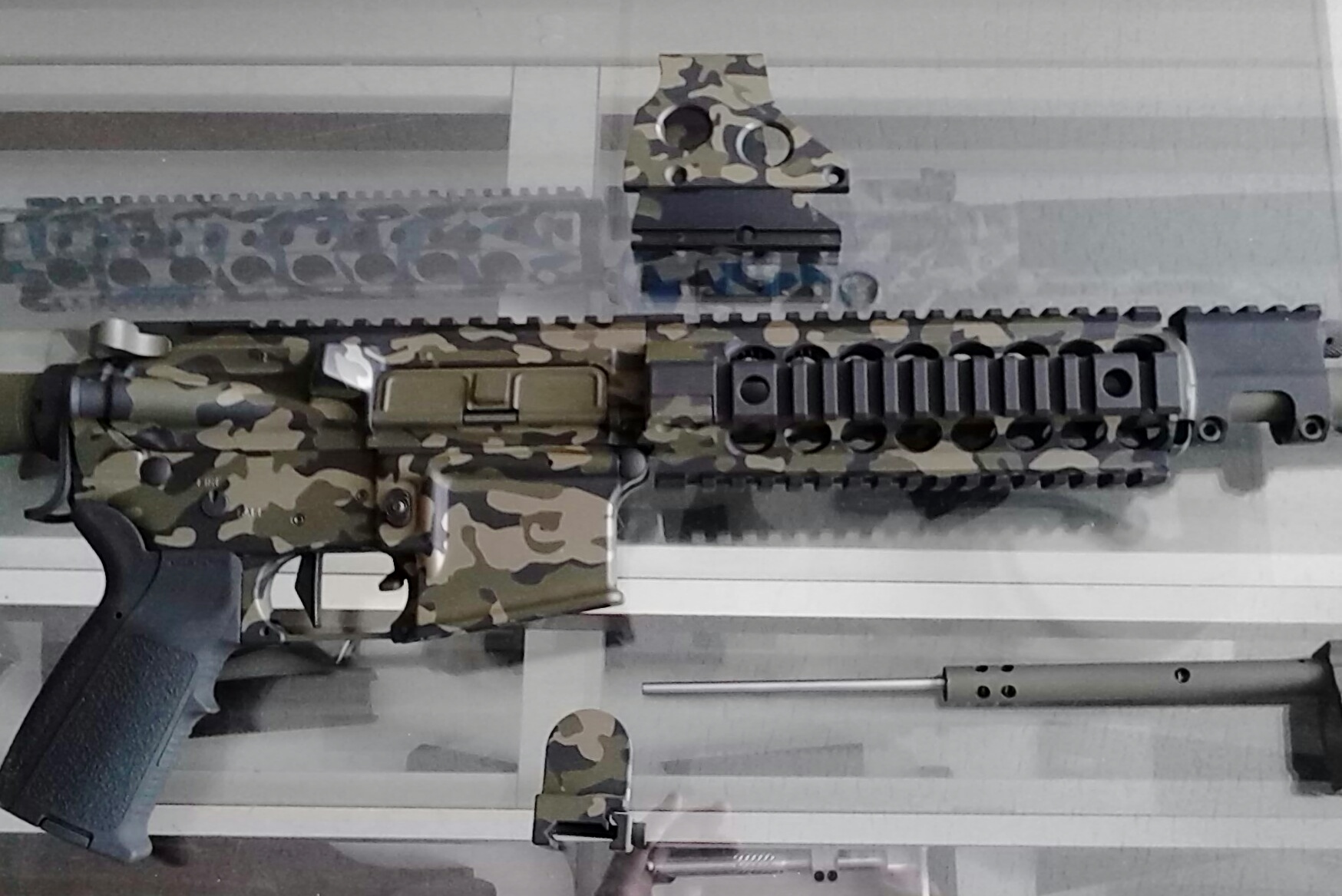 Recent three paint Cerakote camo job on an AR-15