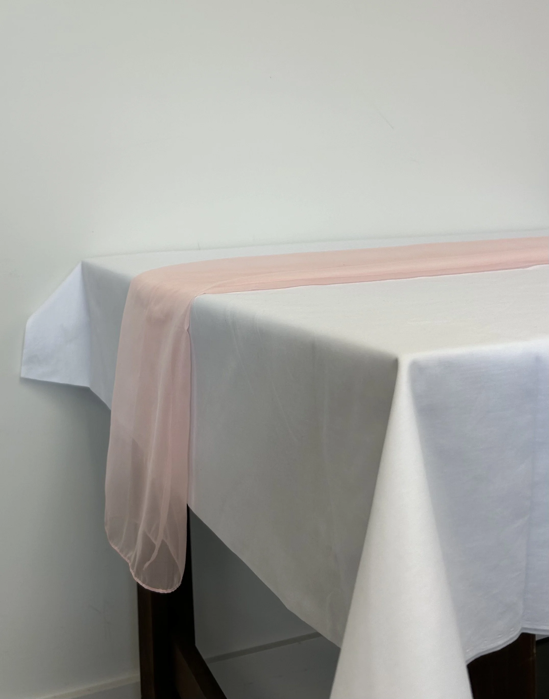 Add a touch of colour with this pink organza table runner