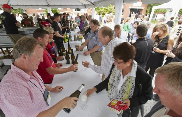 People gathering to sample different wines during the Chardonnay in the Vineyard event at i4C