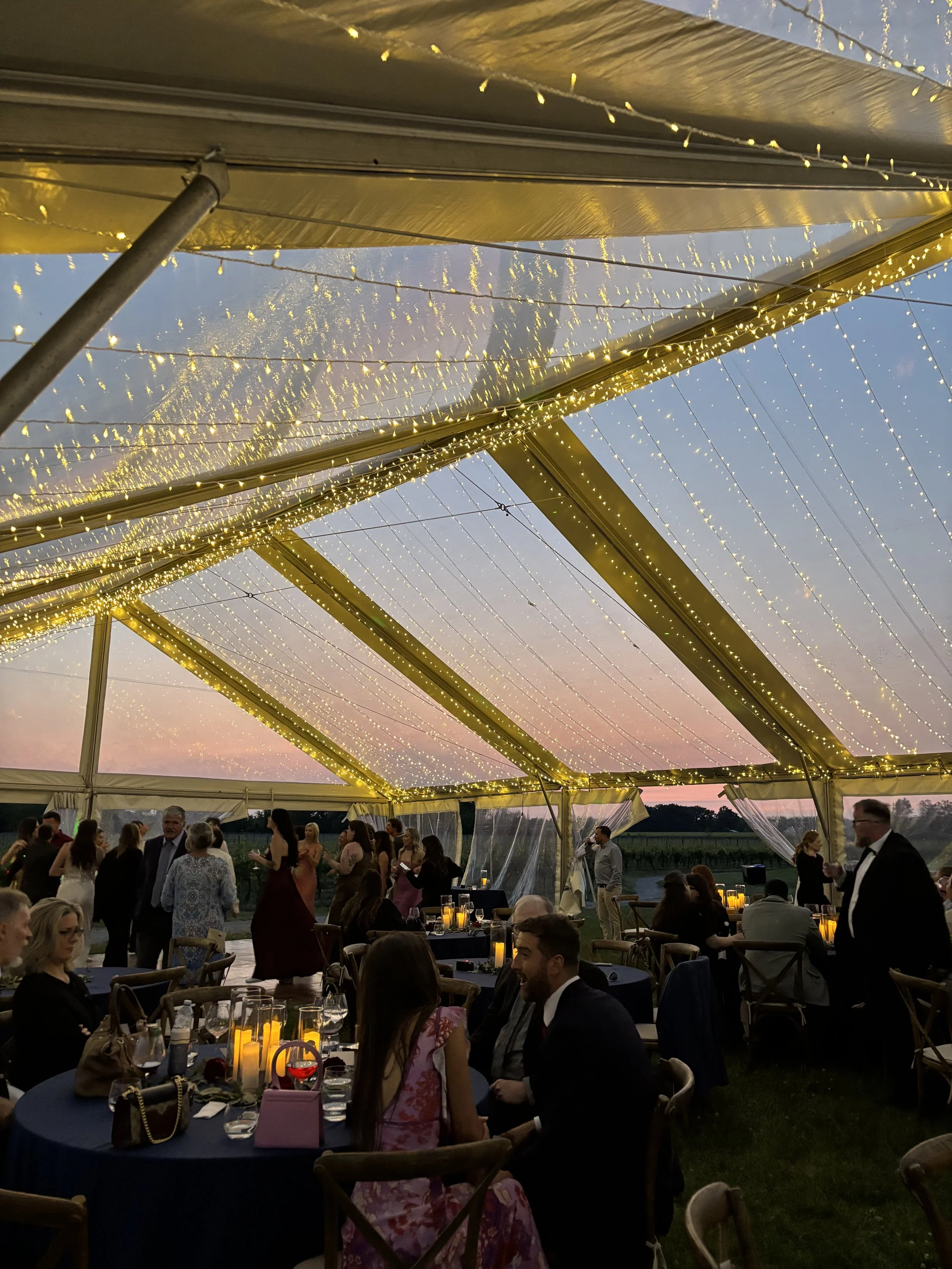 Outdoor curtain light installation for wedding at Henry of Pelham