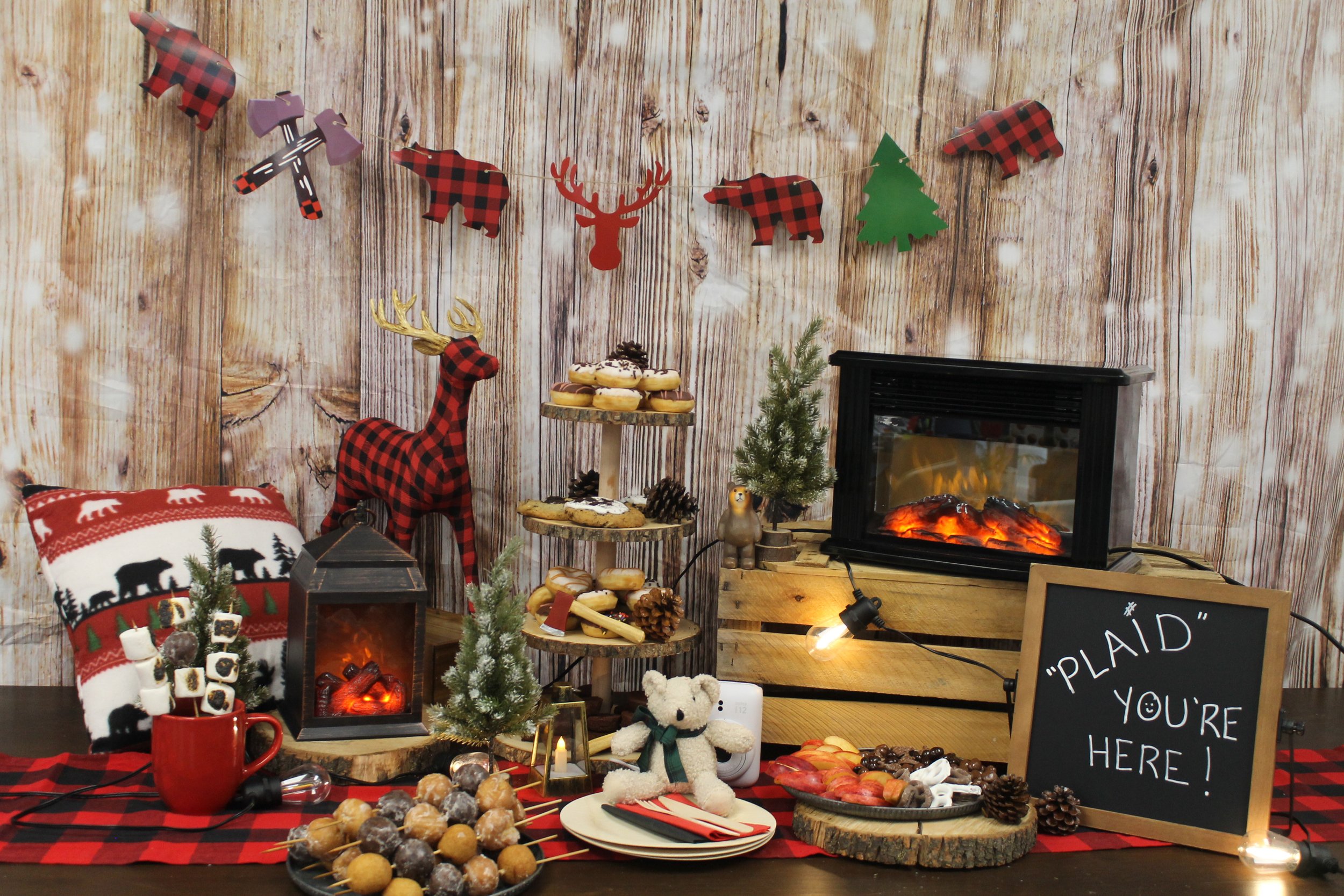 Buffet dressed up in plaid with a small fireplace heater for a rustic look