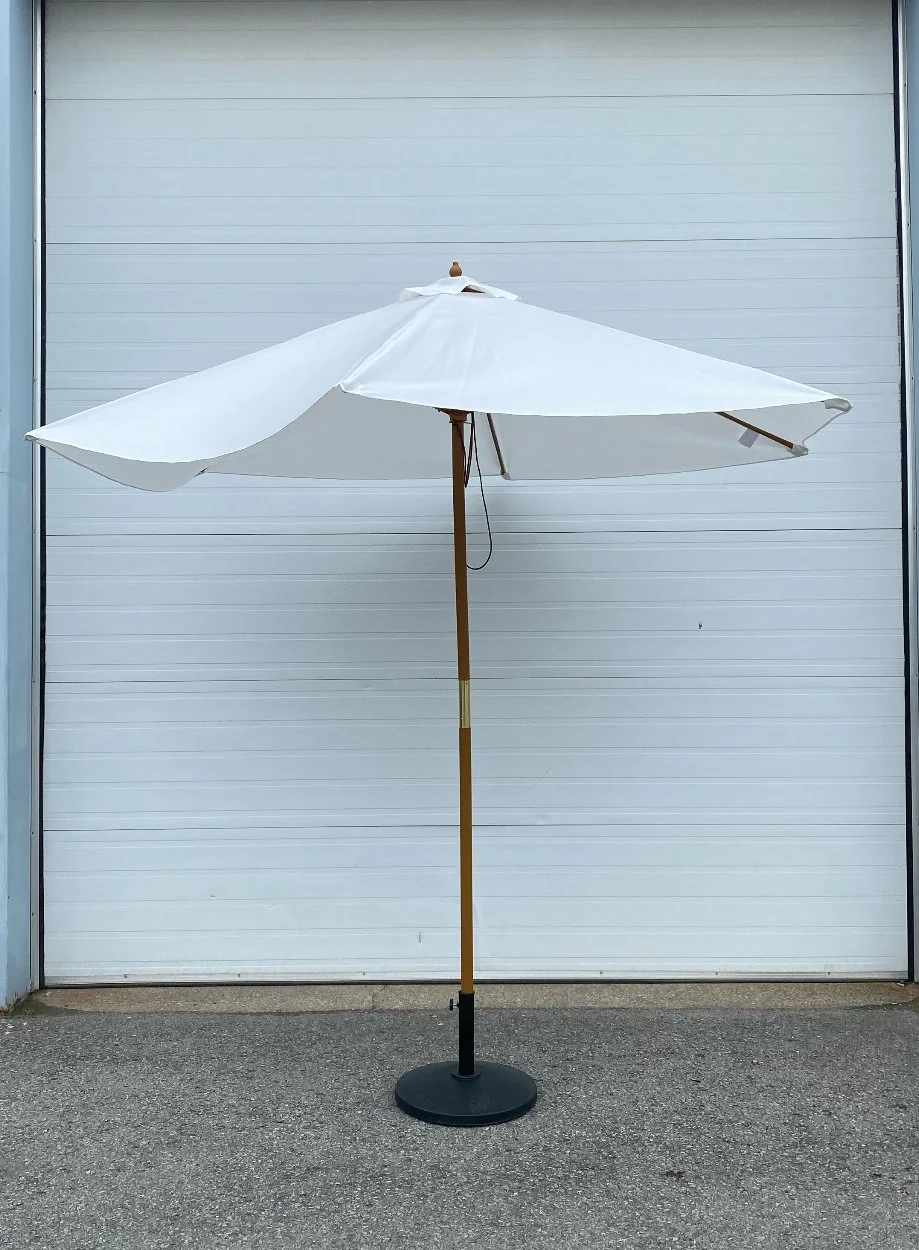 White umbrella with wood and gold fixtures is a neutral and practical piece to add to any outdoor event