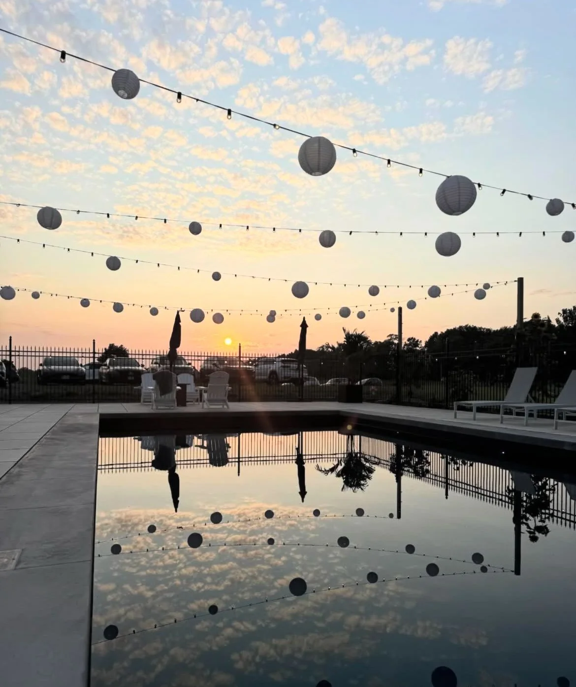 Globe string lights and paper lanterns on display at an anniversary party