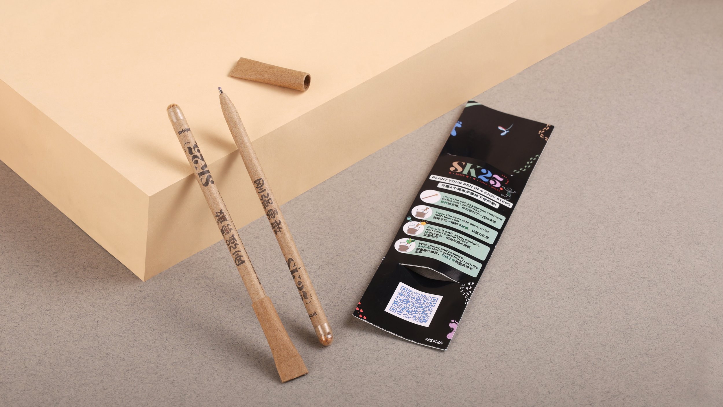 Custom plantable seed pens made from recycled kraft paper with branded SK25 packaging card, eco-friendly promotional merchandise