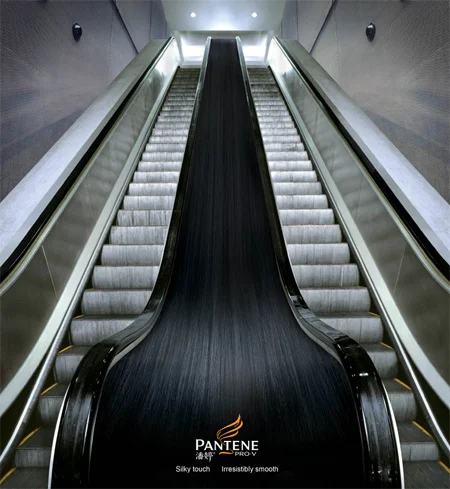 Long Silky Smooth Hair Promise via Pantene's Escalator Sticker Ad Image Credits: http://www.toxel.com/inspiration/2009/08/19/clever-and-creative-escalator-advertising/