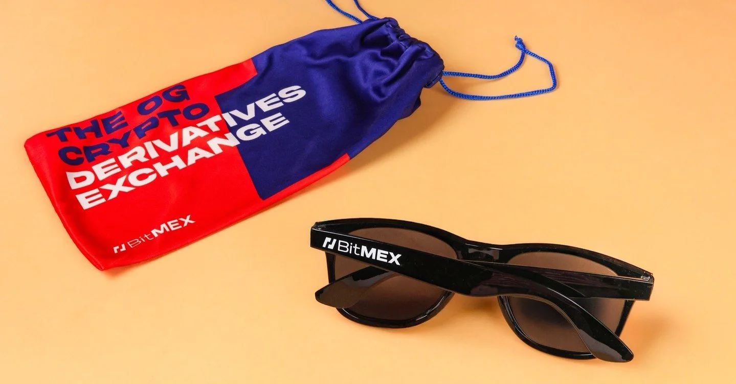 Markets go up and down but when your brand has a reputation, your merch should match.

BitMEX&rsquo;s custom shades deliver clarity in style and identity making even sunglasses feel like a statement piece. 

#b2bmarketing #brandedmerch #creativebrand