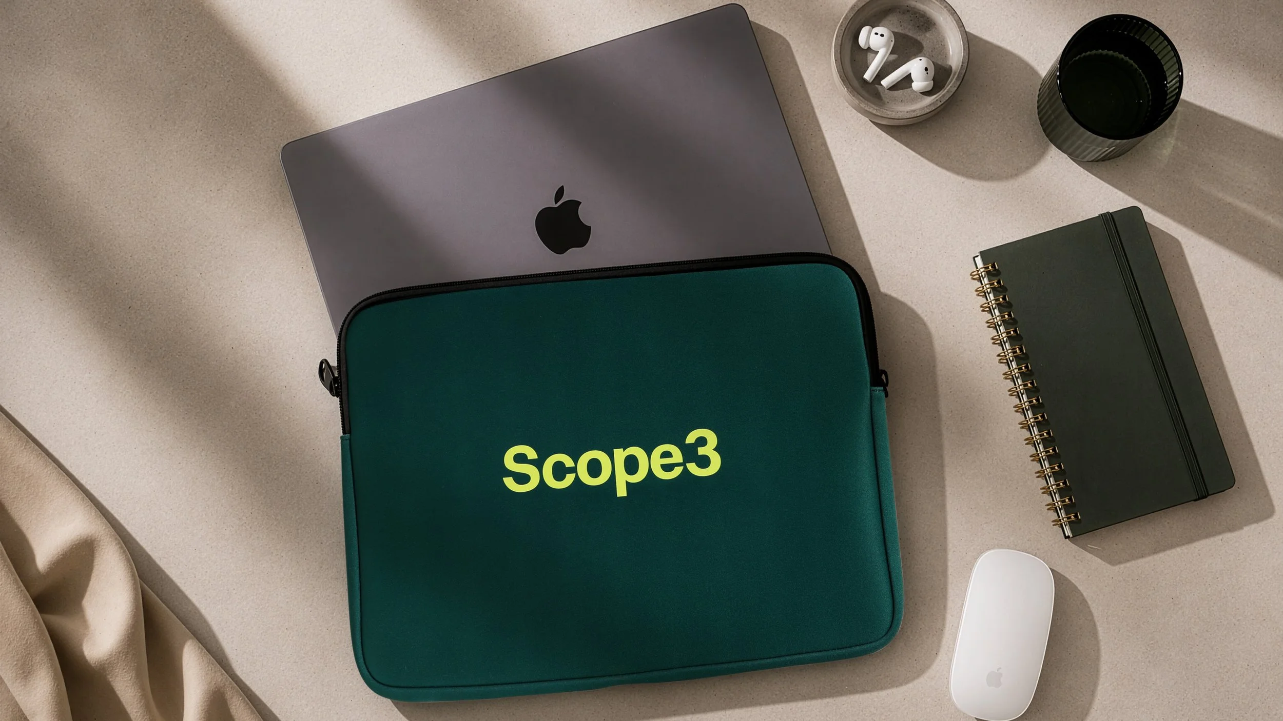 Custom teal neoprene laptop sleeve with Scope3 logo printed in yellow for MacBook, branded promotional gift for employee engagement and corporate giveaways