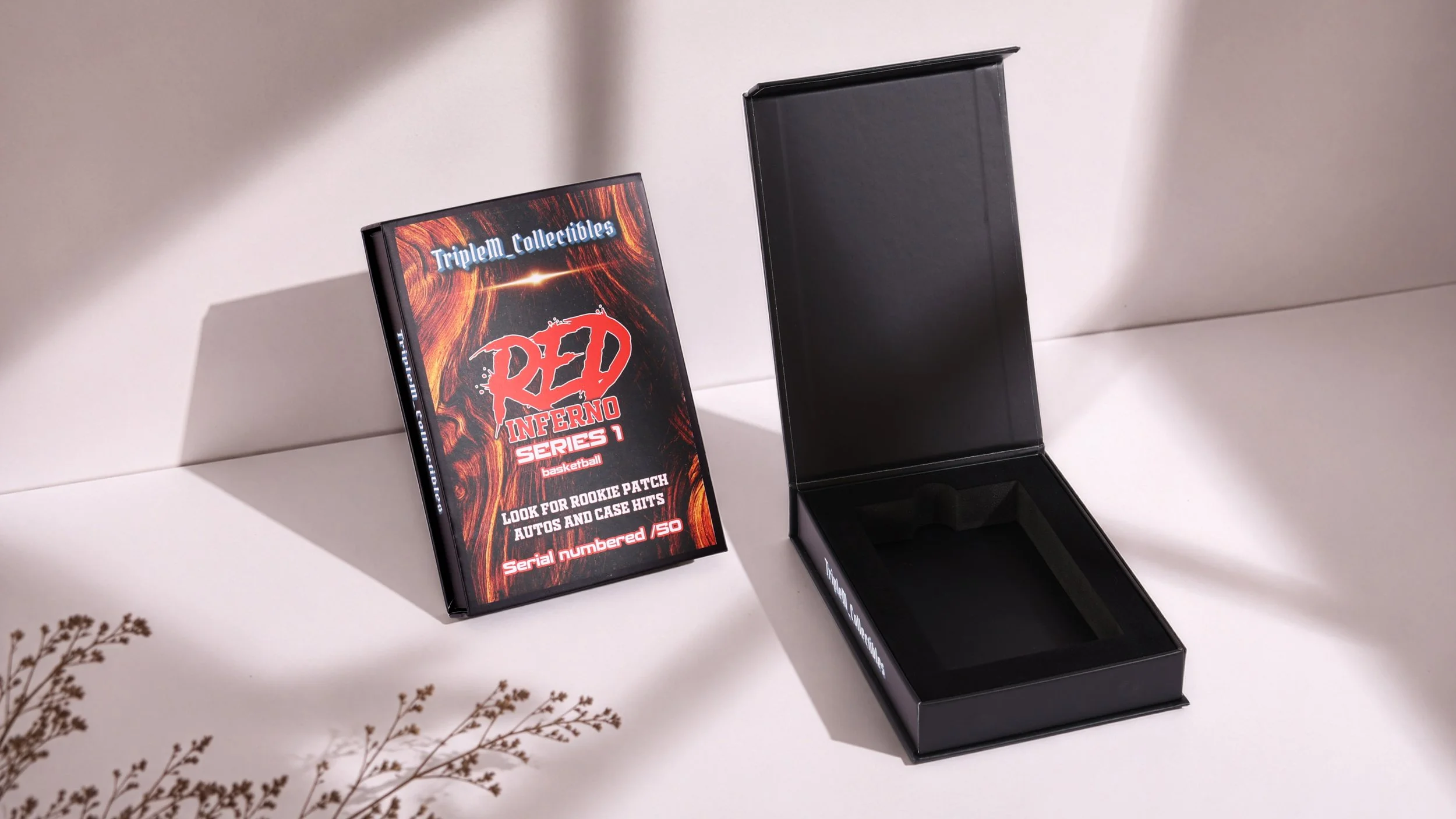 Black custom rigid box packaging with red flame graphics for collectible cards, showing open and closed magnetic closure design with branded printing