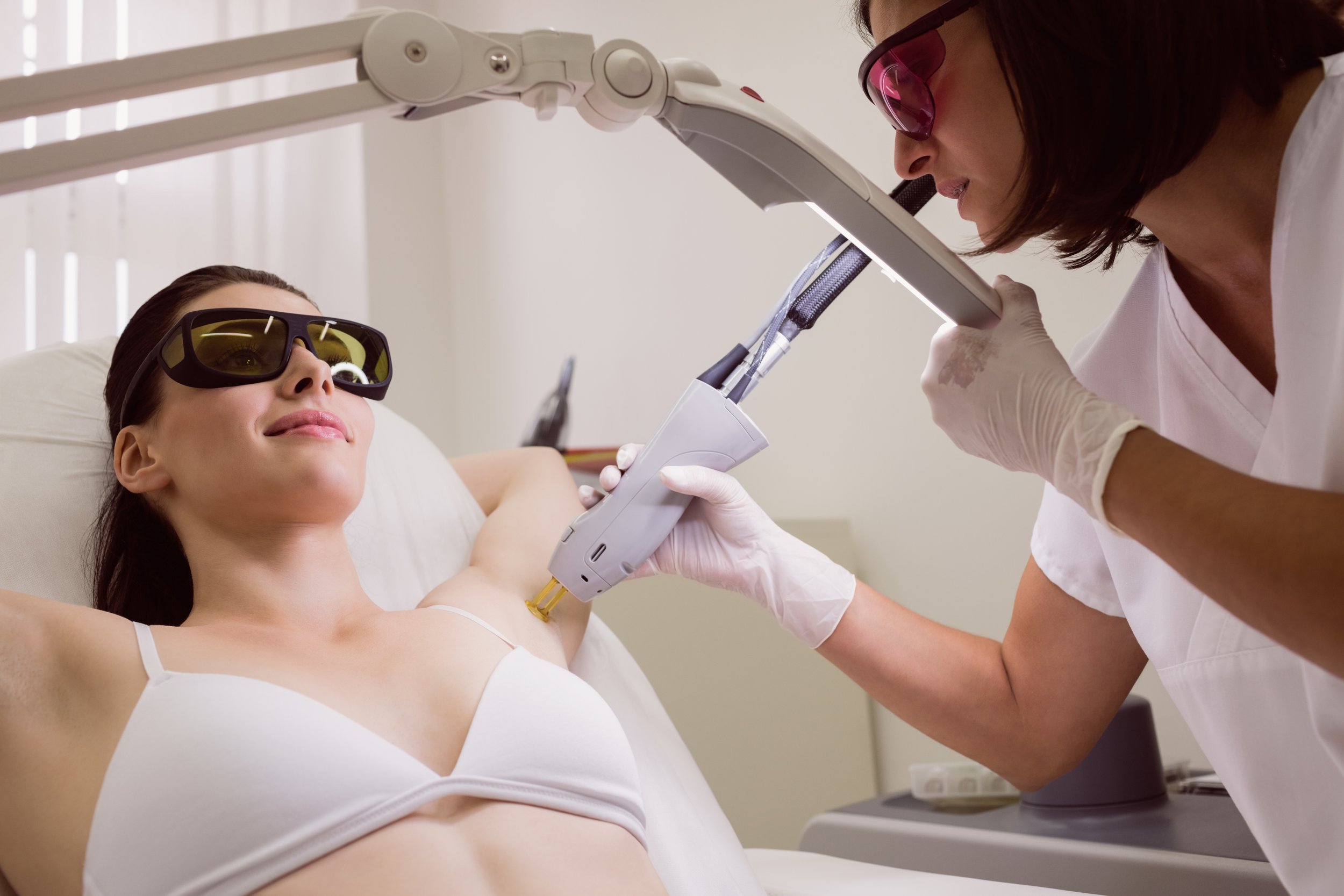 doctor-performing-laser-hair-removal-patient-skin.jpg