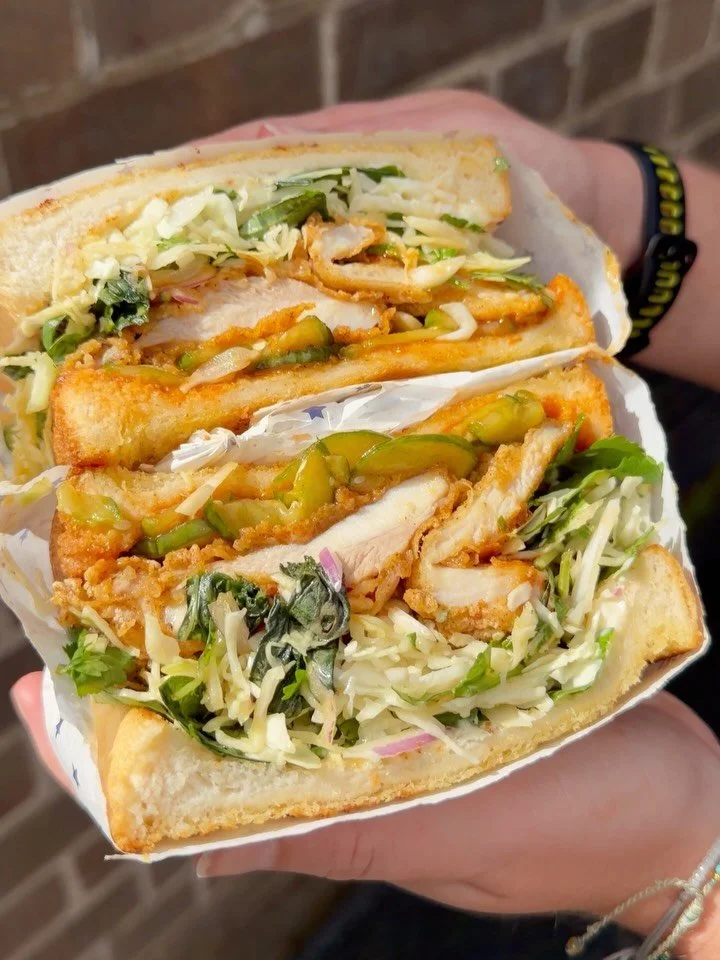 FRIED CHICKEN SANDO! Our latest and greatest, with sweet and spicy sauce, pickled cucumber, cabbage slaw, fresh herbs and Japanese mayo. We&rsquo;re obsessed 🔥 Get it all day long.