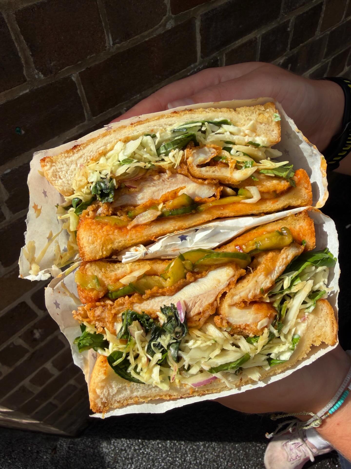 Fried Chicken Sando in the House! Better than ever with sweet and spicy sauce, pickled cucumber, slaw, herbs and Japanese mayo.