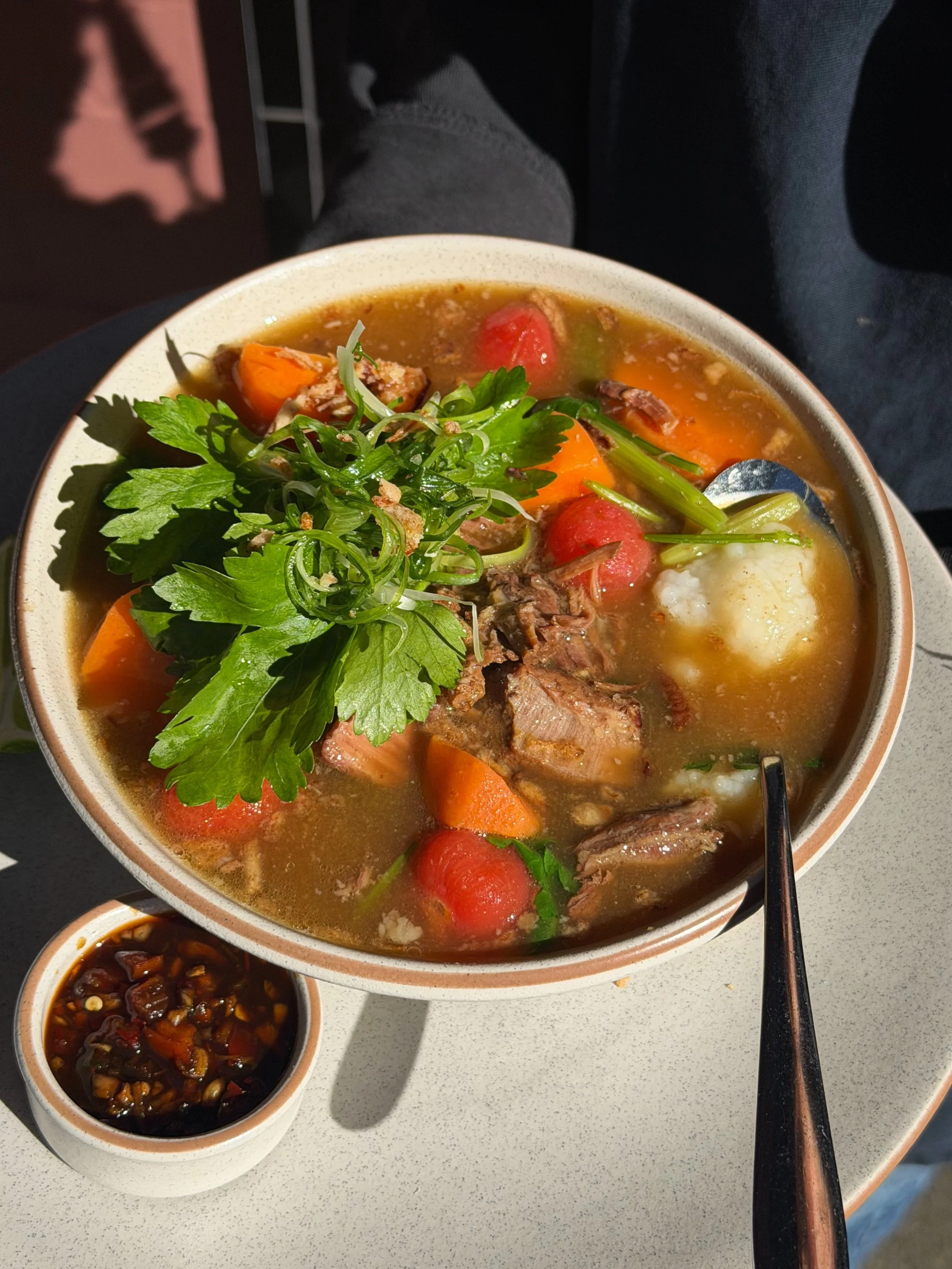 See out winter with Sop Buntut Congee! A most nourishing bowl of beef &amp; oxtail braised in aromatic broth, served on congee with Chinese celery, cherry tomato, carrot and fried shallots 💯