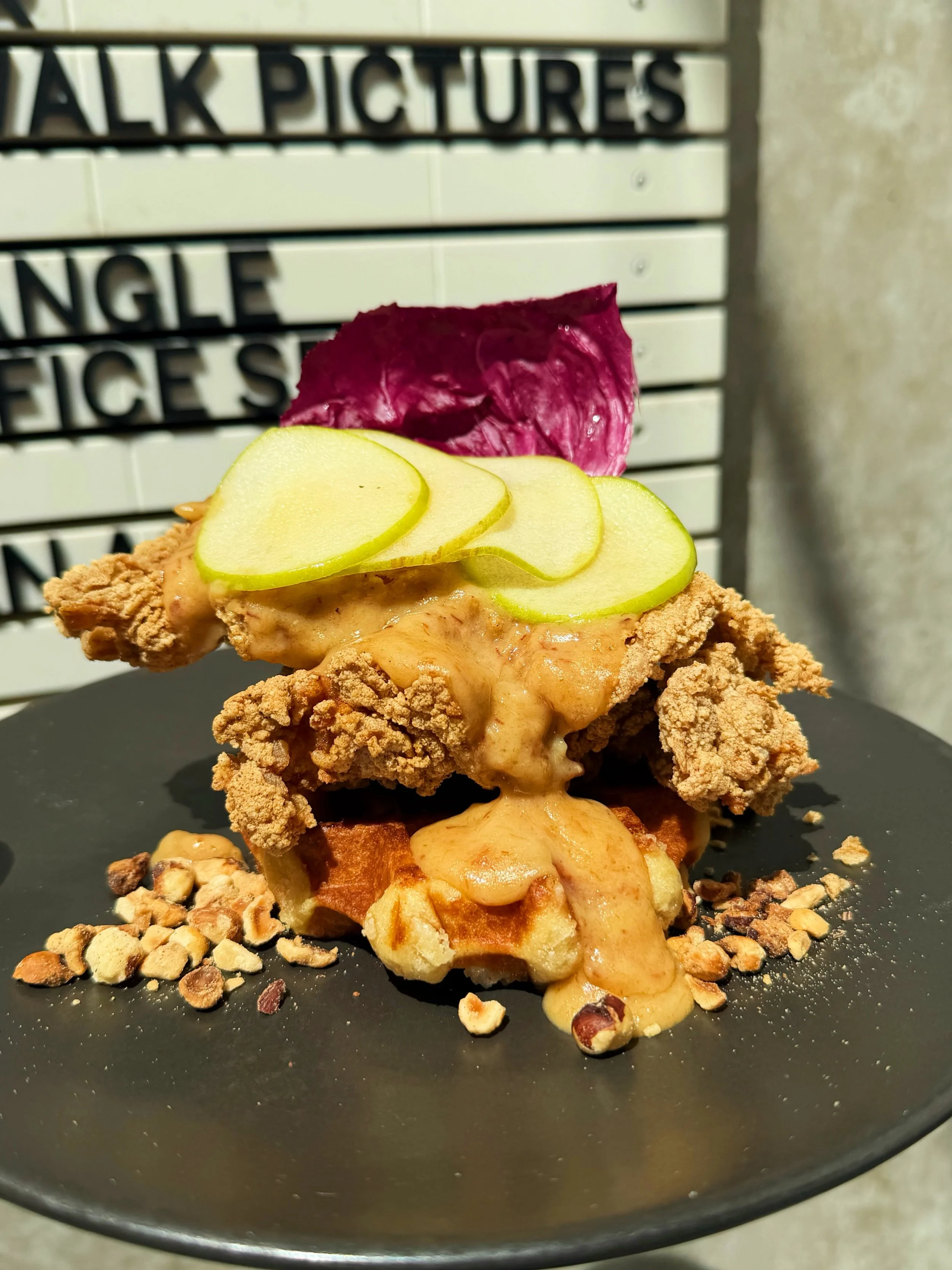 WAFFLE ON. House fried chicken, maple bacon gravy, pickled green apple, radicchio and toasted hazelnut. Our #1 since Day 1.