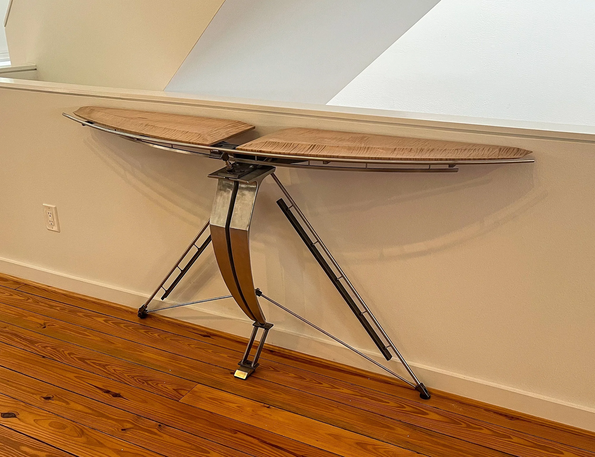  Winged Console of Victory 4th of 5qty  Available   Curly maple top, sand cast aluminum leg construct (from sofa back post molds I made previously), stainless and blackened steel. 