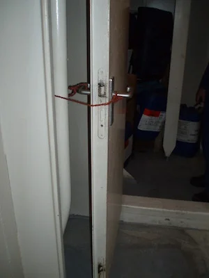 Fire screen door tied open