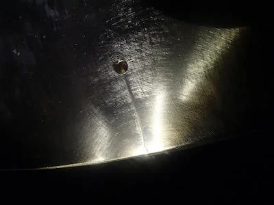 Basic risk assessment: better having a crack arrested than yourself; this is a crack in a propeller blade being arrested by a borehole