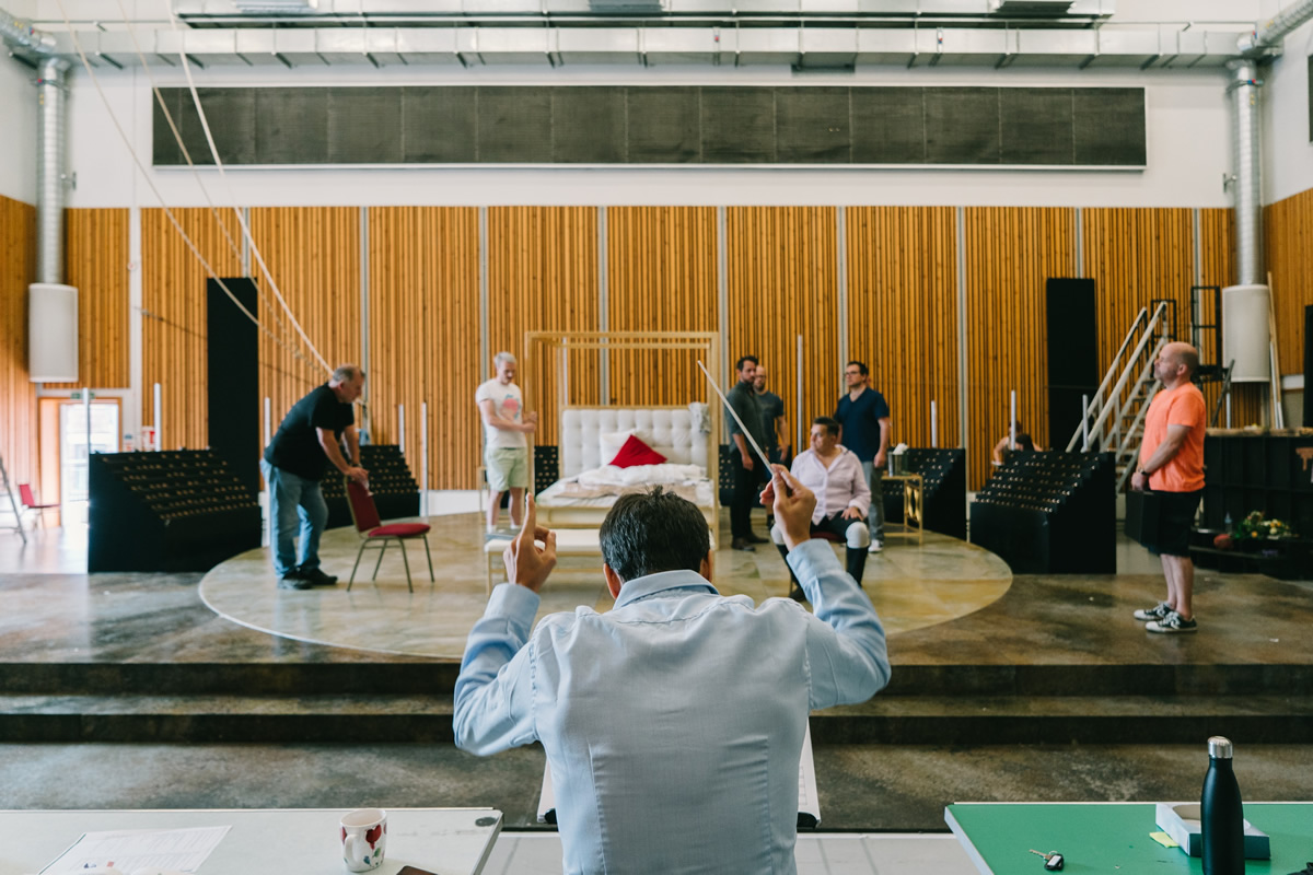 Conducting the company of Tosca in rehearsal at Opera North . Photo credit: © Tom Arber
