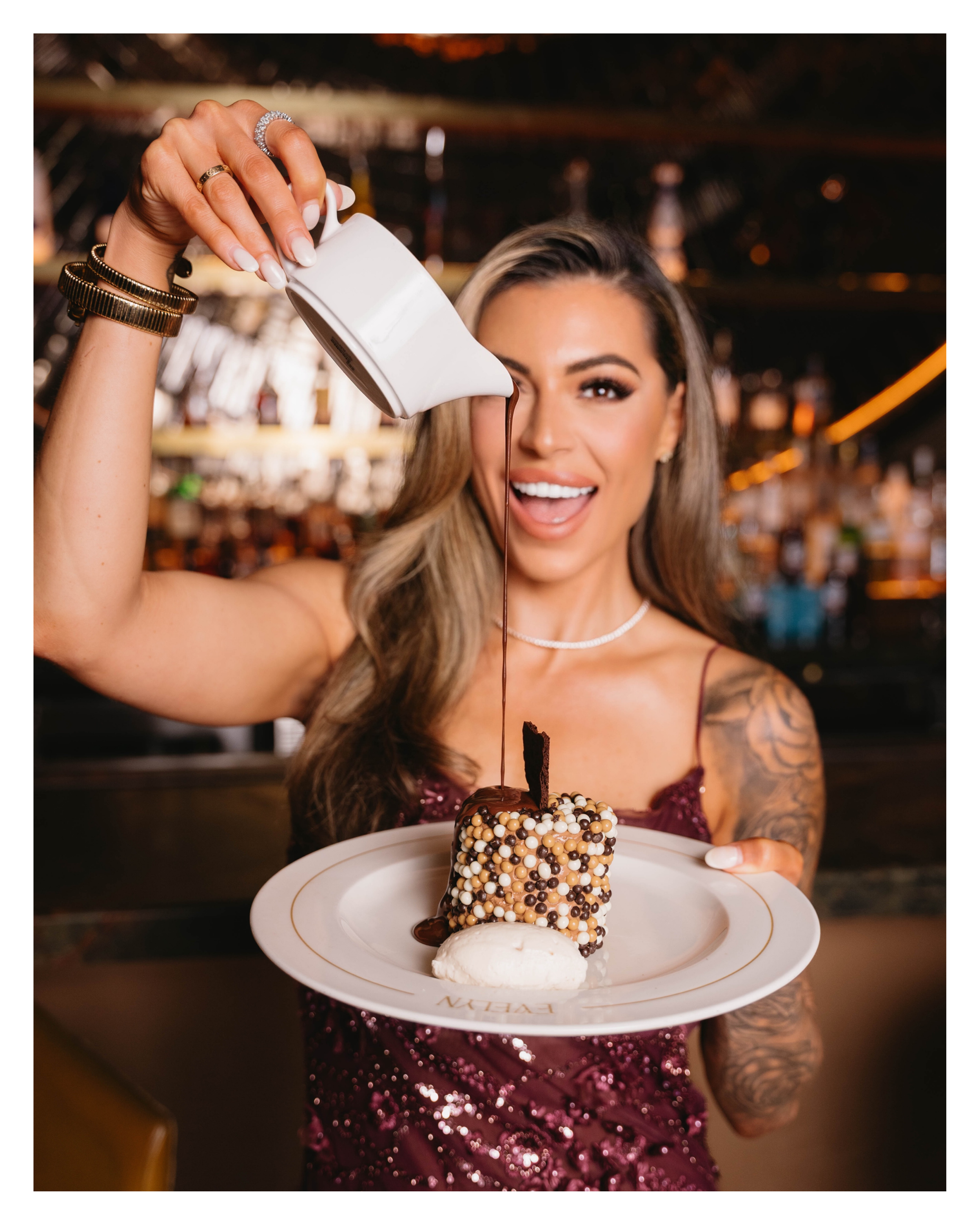 Chocolate sauce poured over dessert on an EVELYN plate during a Dallas restaurant social media shoot