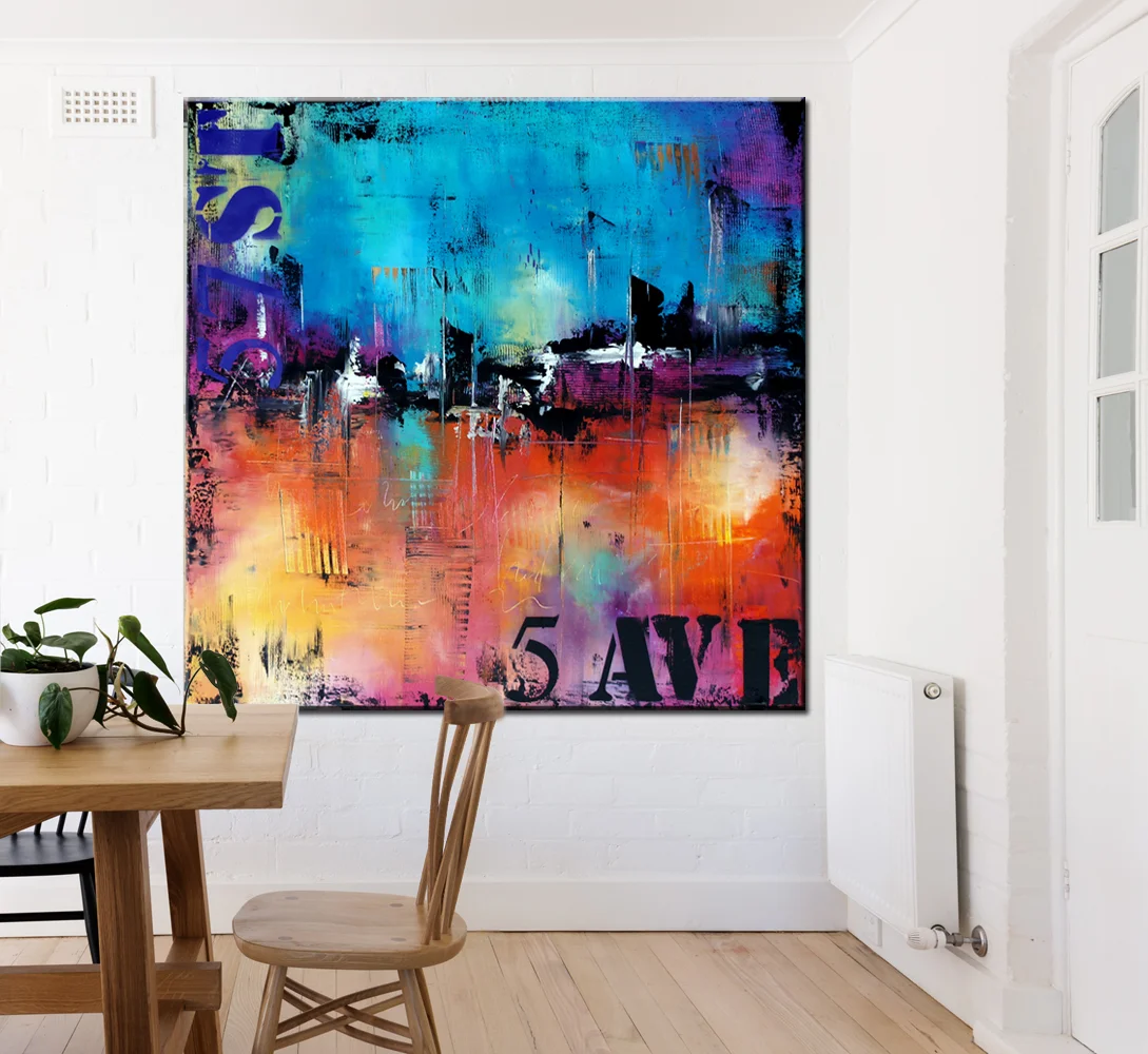 Blank framed print on white wall in danish styled interior dinin