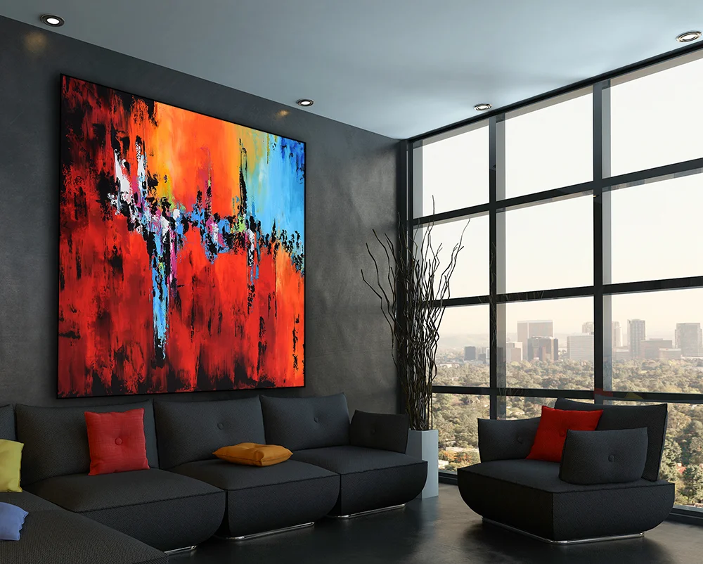 Black couch with colorful pillows against wooden wall