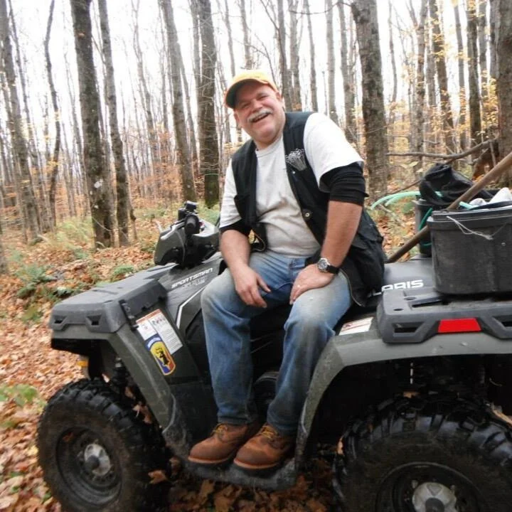 Don Gale on the ATV in the sugar bush