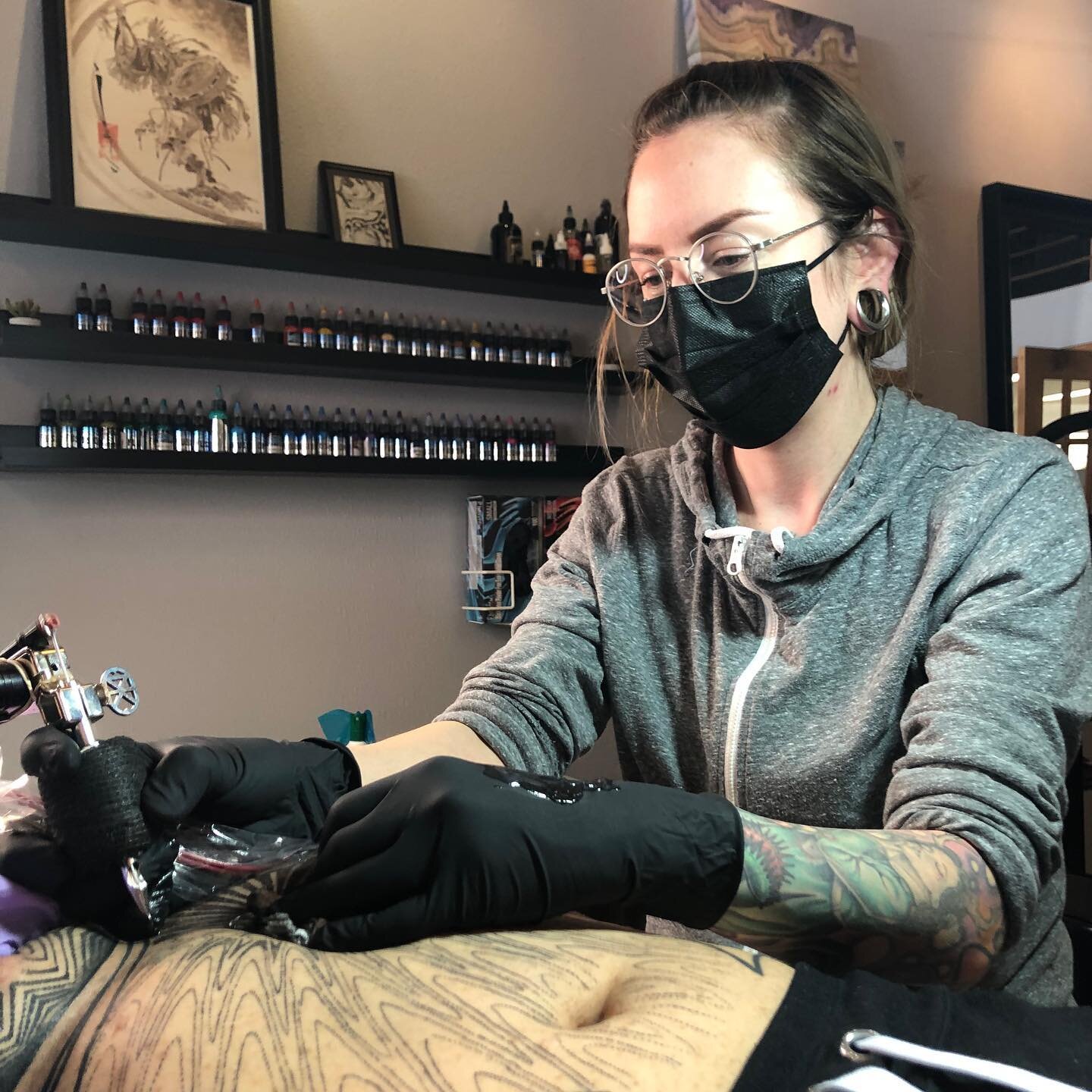 It&rsquo;s been awhile since someone has photographed me while working besides a customer 😂 Action shot, thanks @privatestocksean #tattooartist #tattoostation